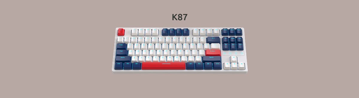 Дешевая механическая клавиатура K87 на однотонном фоне.